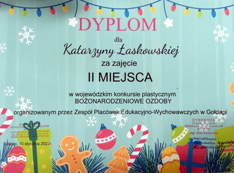 Dyplom z ozdobami świątecznymi. Na nim napis: dyplom dla Katarzyny Łaskowskiej za zajęcie II miejsca w wojewódzkim konkursie plastycznym Bożonarodzeniowe ozdoby, organizowanym przez Zespół Placówek Edukacyjno-Wychowawczych w Gołdapi. Gołdap, 10.01.2022 r.